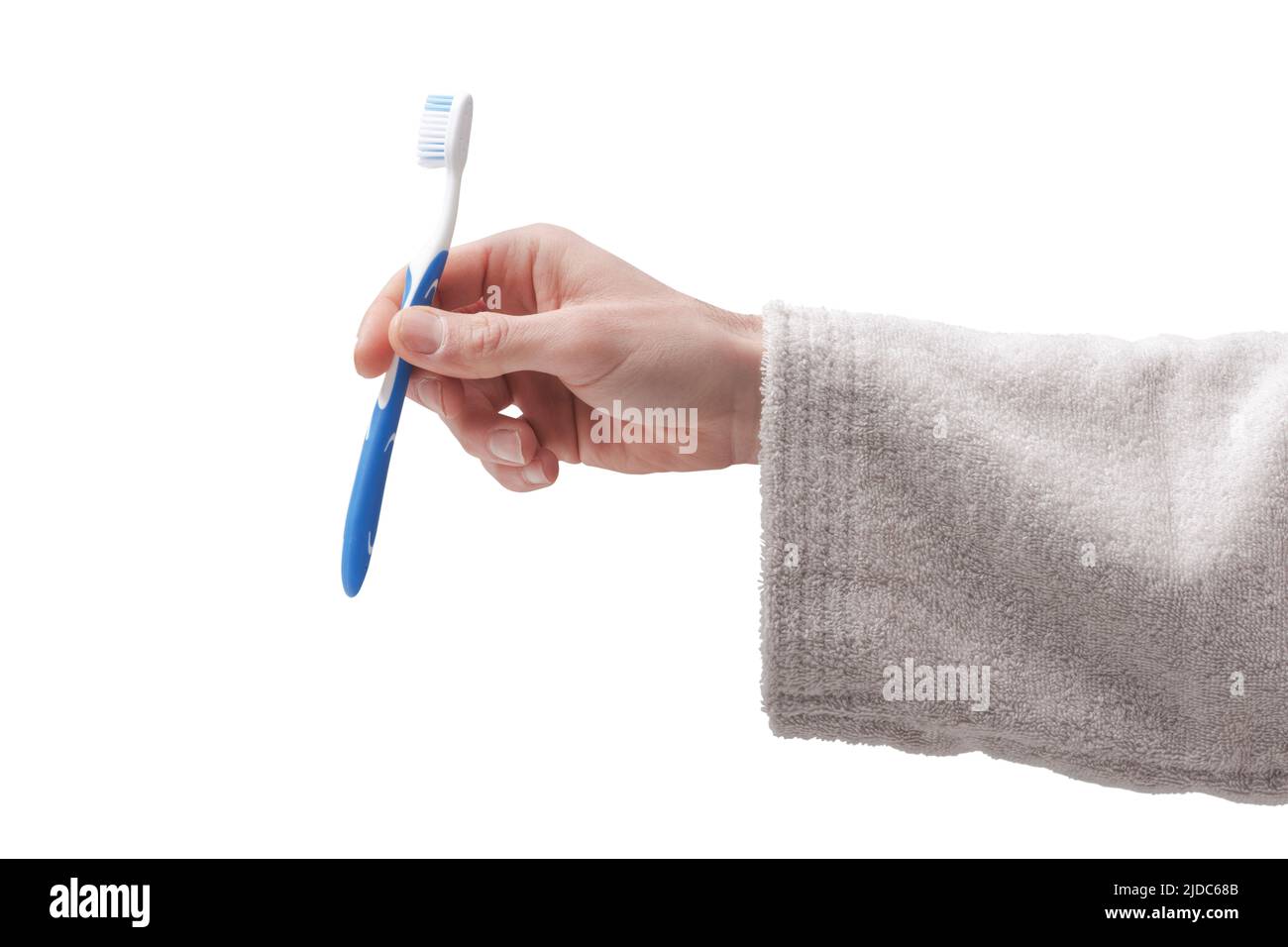 Taking Toothbrush Man Man cleaning teeth in the bathroom, he is taking his toothbrush on ...