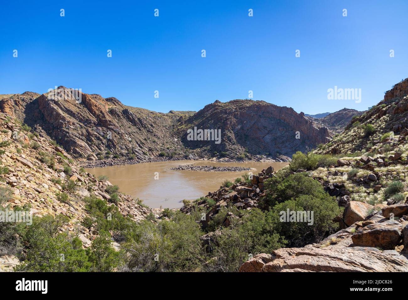 Area in the Augrabies National park called Echo corner. The brown water of the Orange river can be seen between the granite hills. Stock Photo