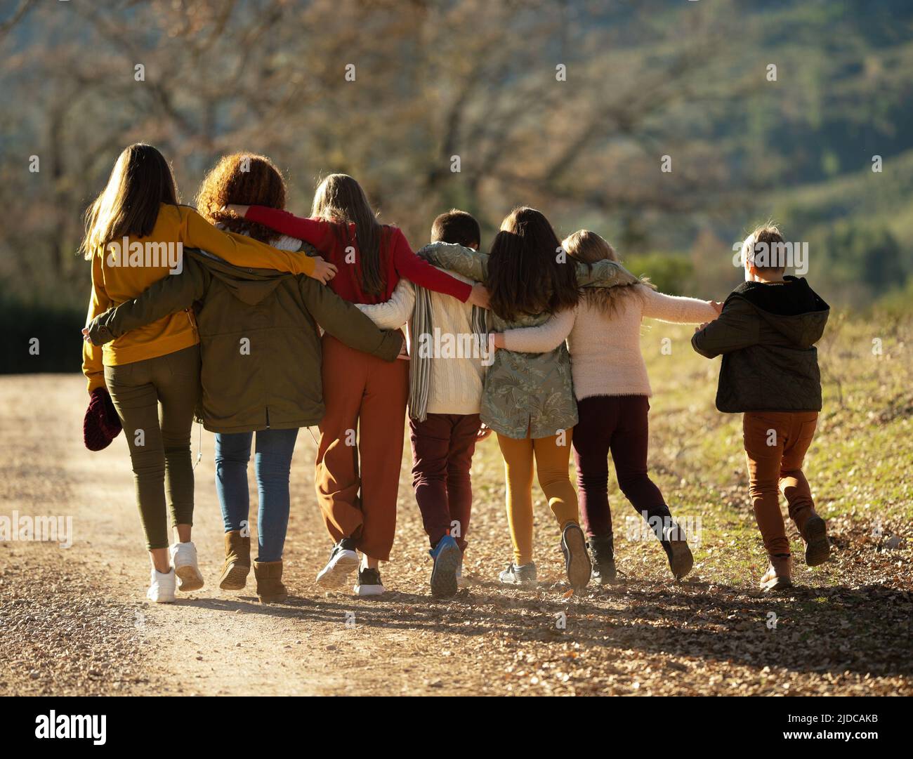Young children teenagers go ahead in the autumn time Stock Photo