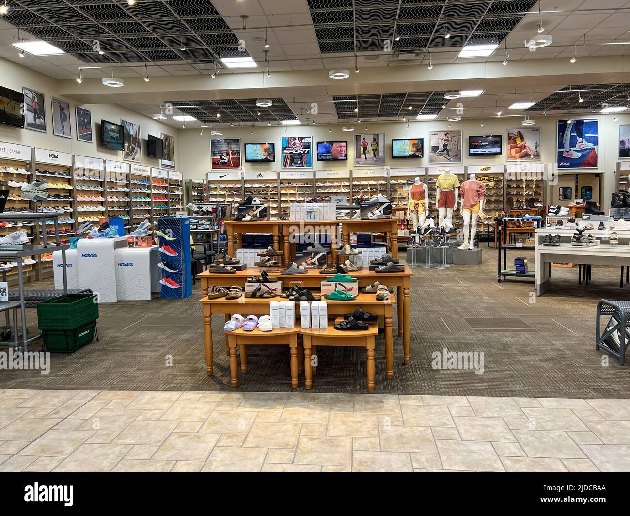 Springfield, IL USA - May 2, 2022: A display of Womens shoes for sale at the Scheels Sporting Goods store in Springfield, Illinois. Stock Photo