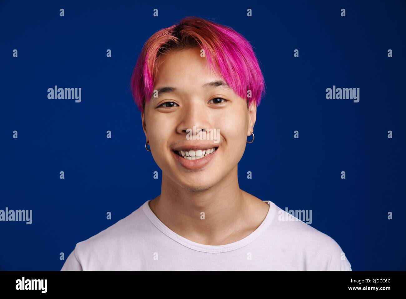 Asian boy smiling blue t shirt hi-res stock photography and images - Alamy