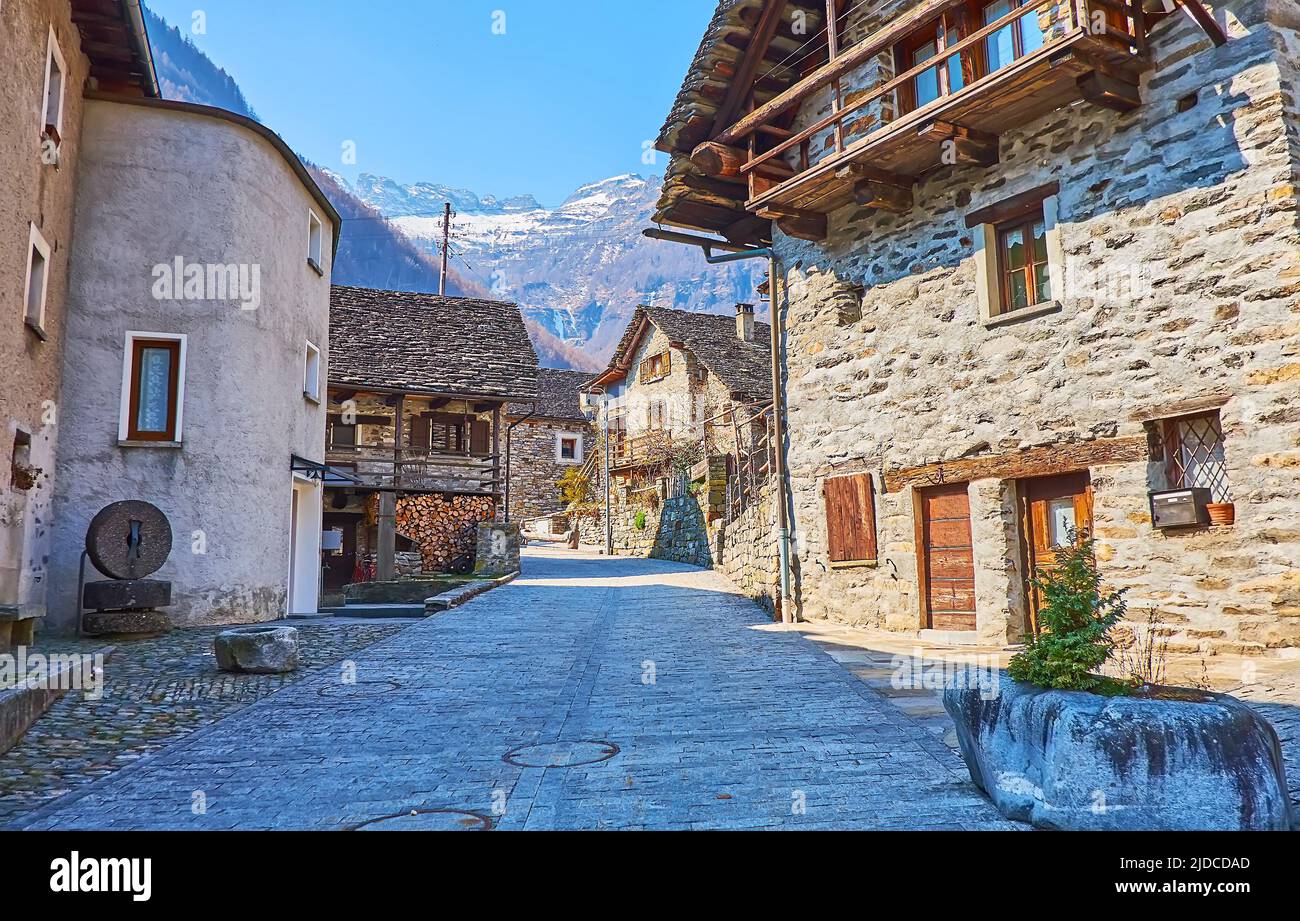 Walk down the narrow curved stone street of historic Sonogno village, Valle Verzasca, Switzerland Stock Photo