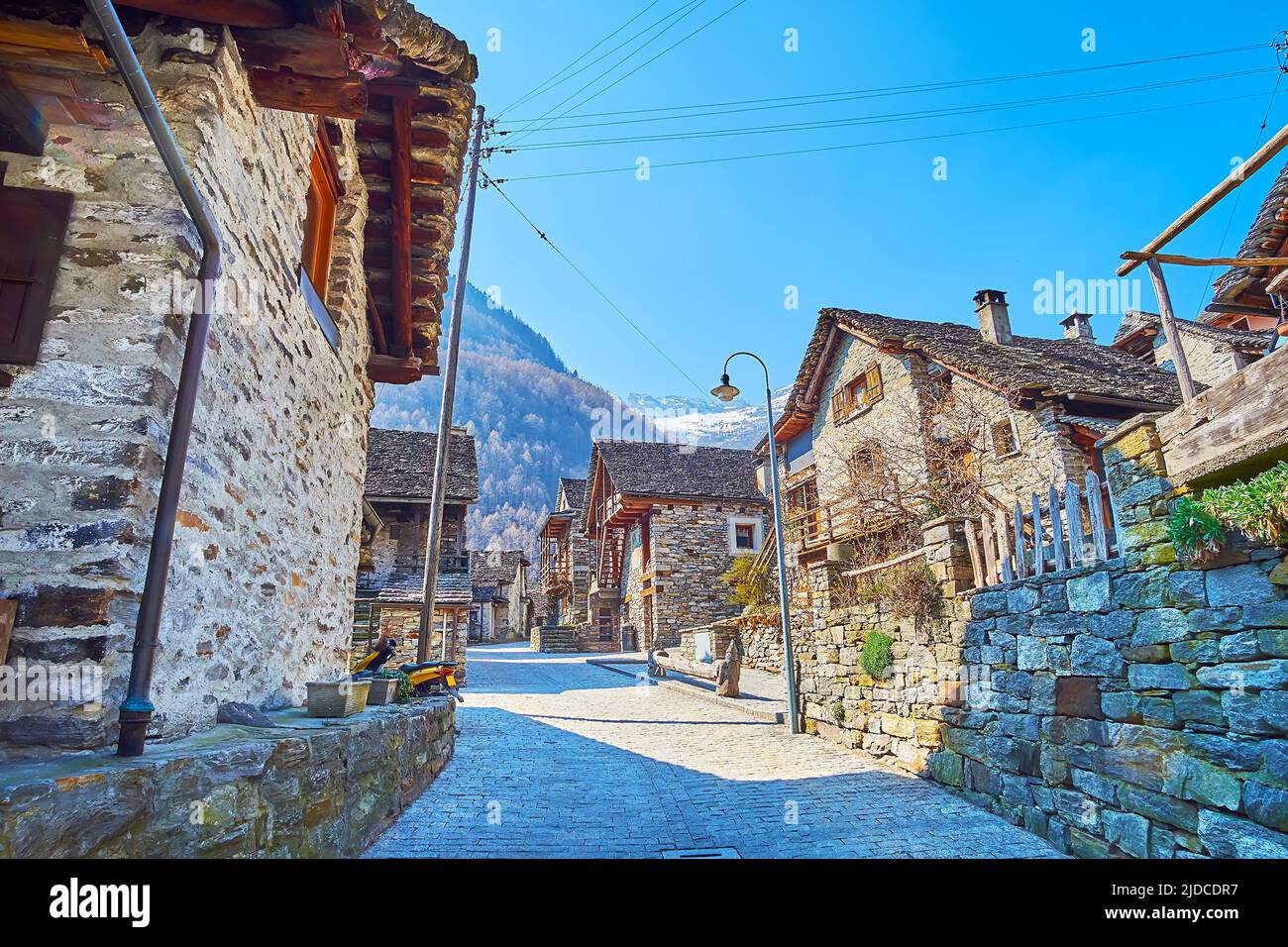 The alley in village with old Alpine stone houses, topped with stone roofs, Sonogno, Valle Verzasca, Switzerland Stock Photo