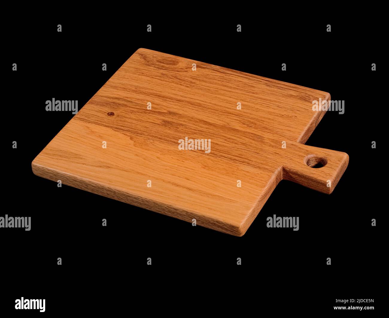 Empty brown oak wood cutting board isolated on black Stock Photo