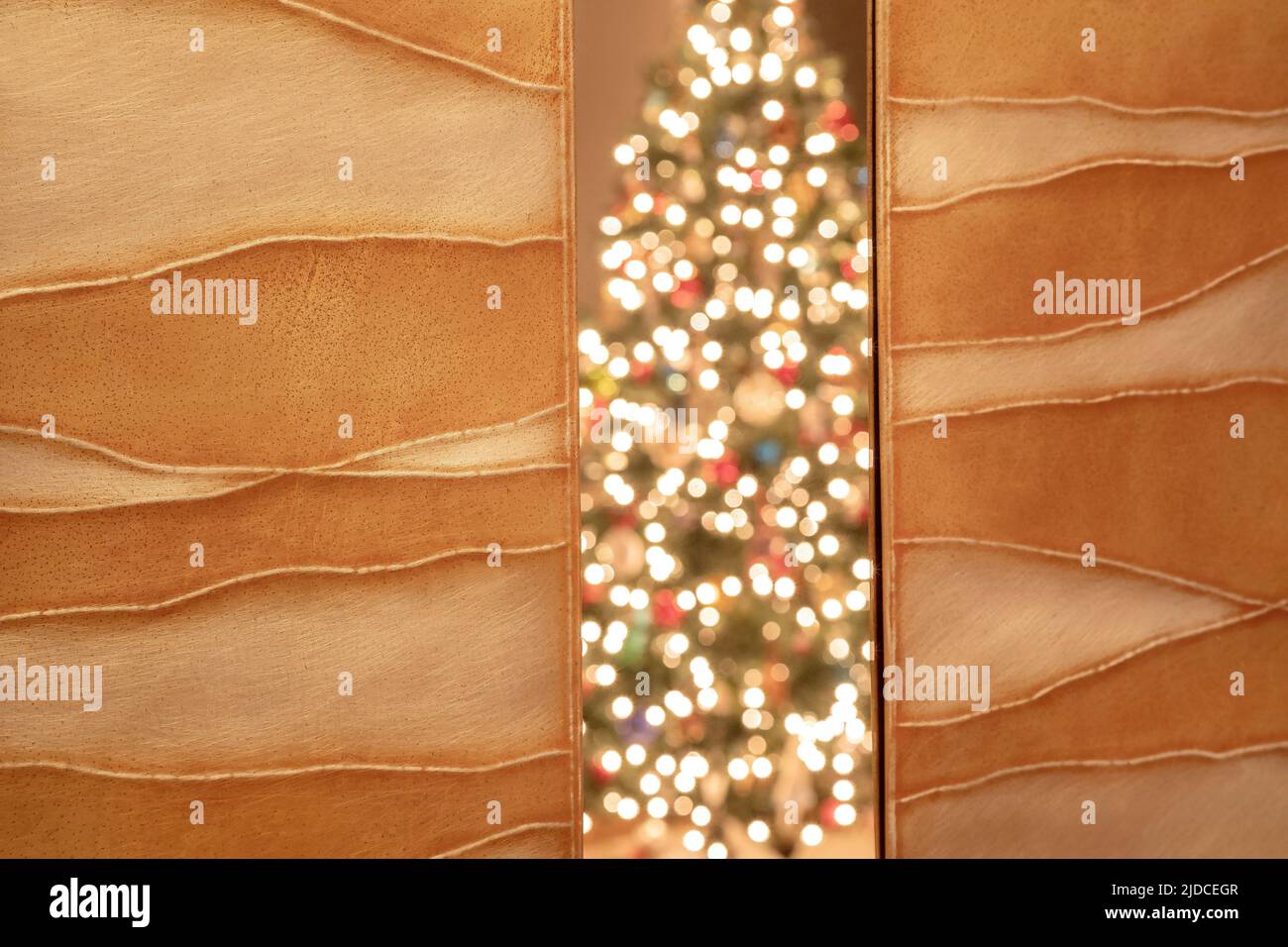A decorated Christmas tree reflected in a mirror Stock Photo