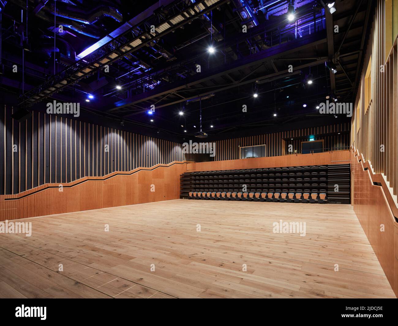 Norwich University of the arts wood timber lined lecture theatre with