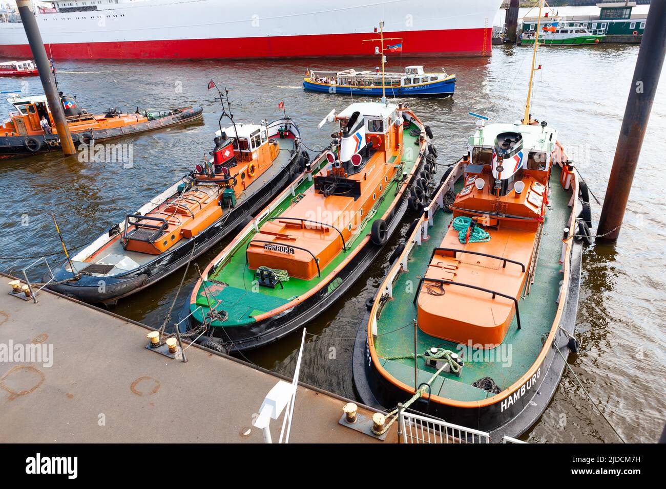 Hamburg, Germany - July 12, 2011 :  Tug boats fastened to Elbe River wharf at Hamburg Harbor. Stock Photo