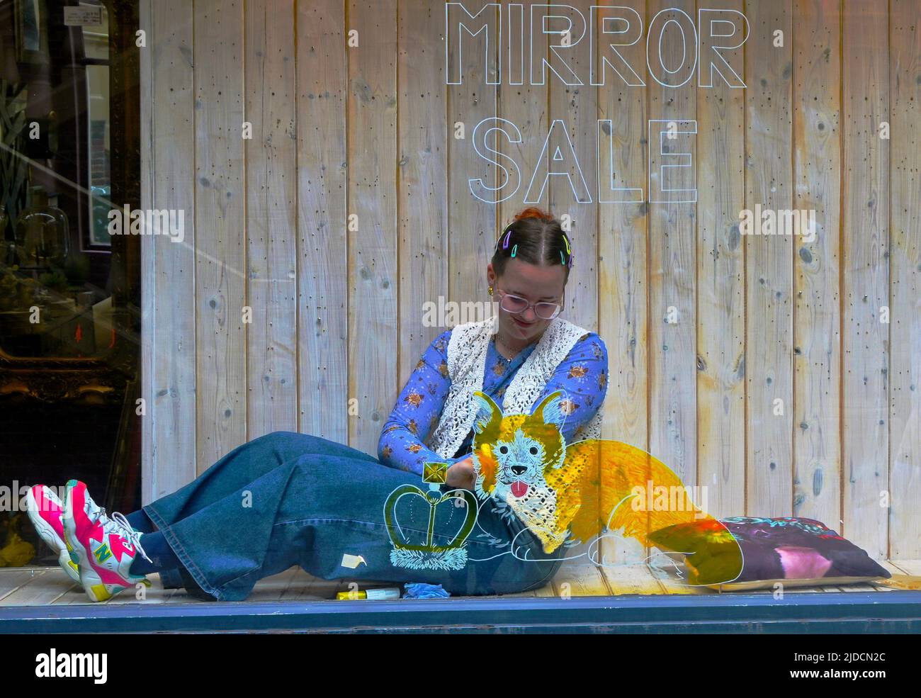 artist painting shop window for platinum jubilee Stock Photo Alamy