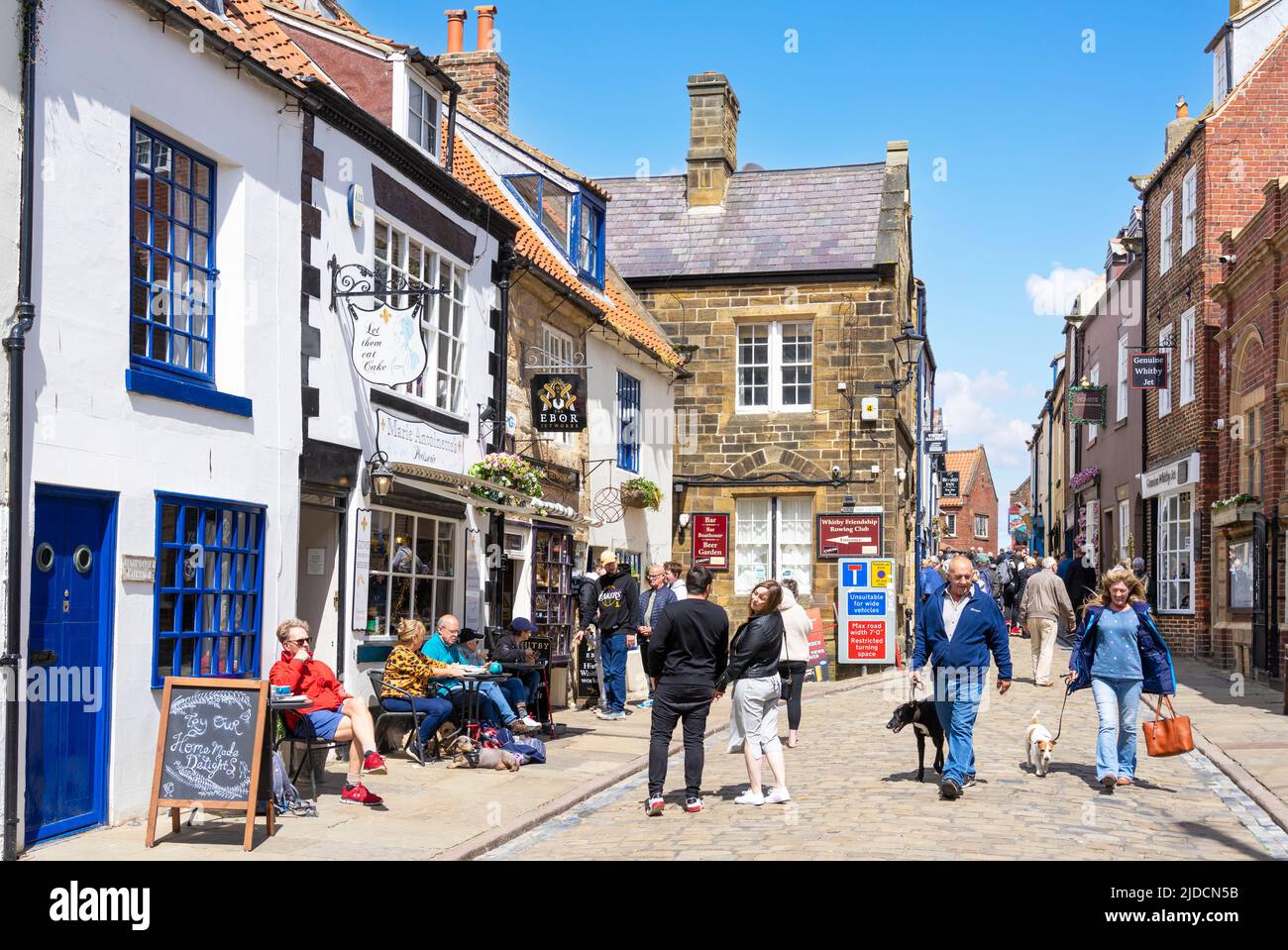 Whitby Yorkshire Whitby Church street with tourists shopping in the gift shops and cafes Whitby North Yorkshire England UK GB Europe Stock Photo