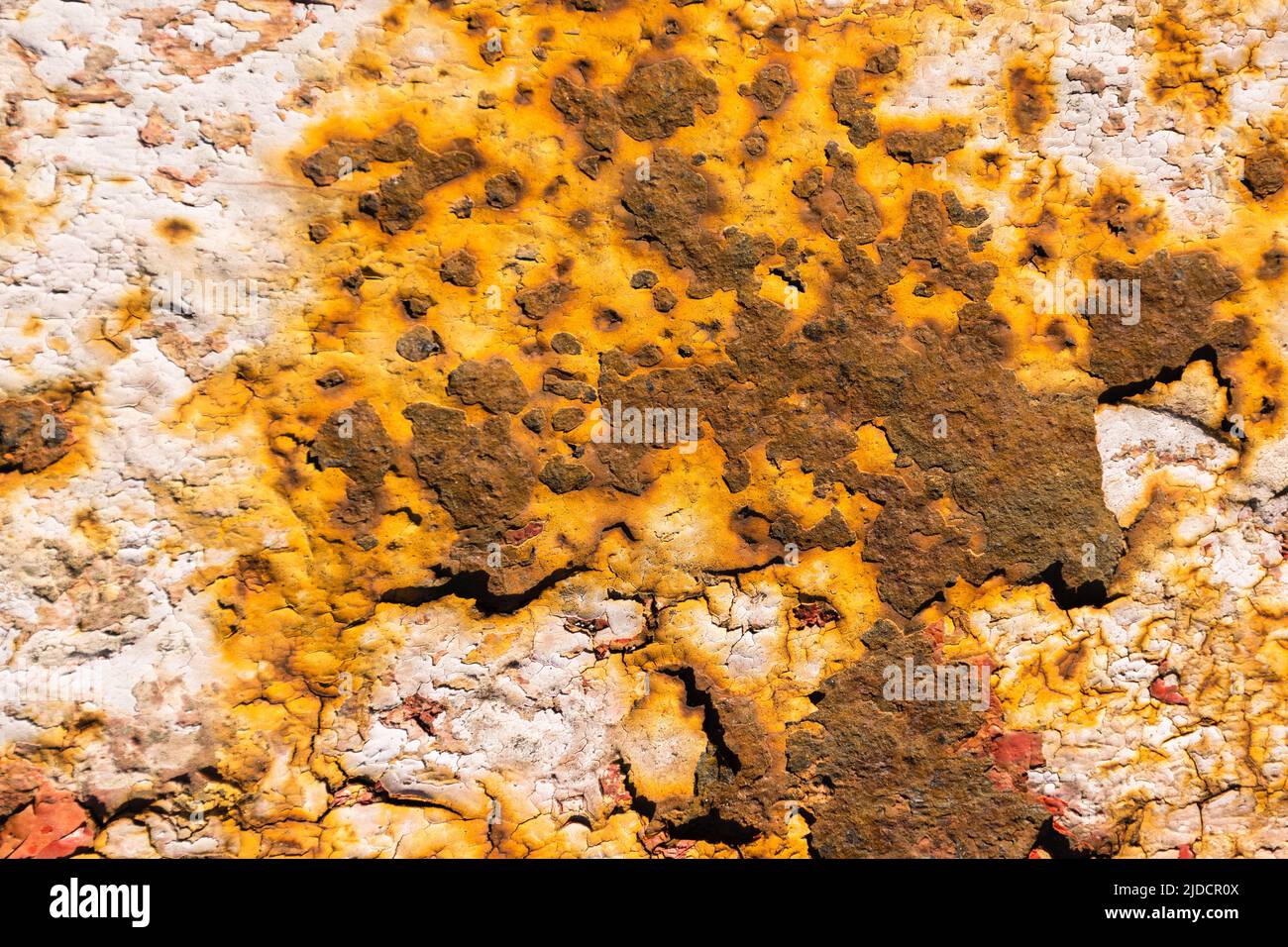 The pattern of old painted rusty metal surface Stock Photo
