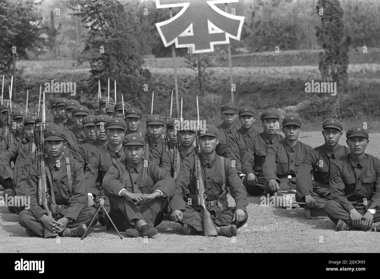 Chinese soldiers of the People's Liberation Army (PLA) sit on a training ground, with rifles and bayonets, July 26, 1972 Stock Photo