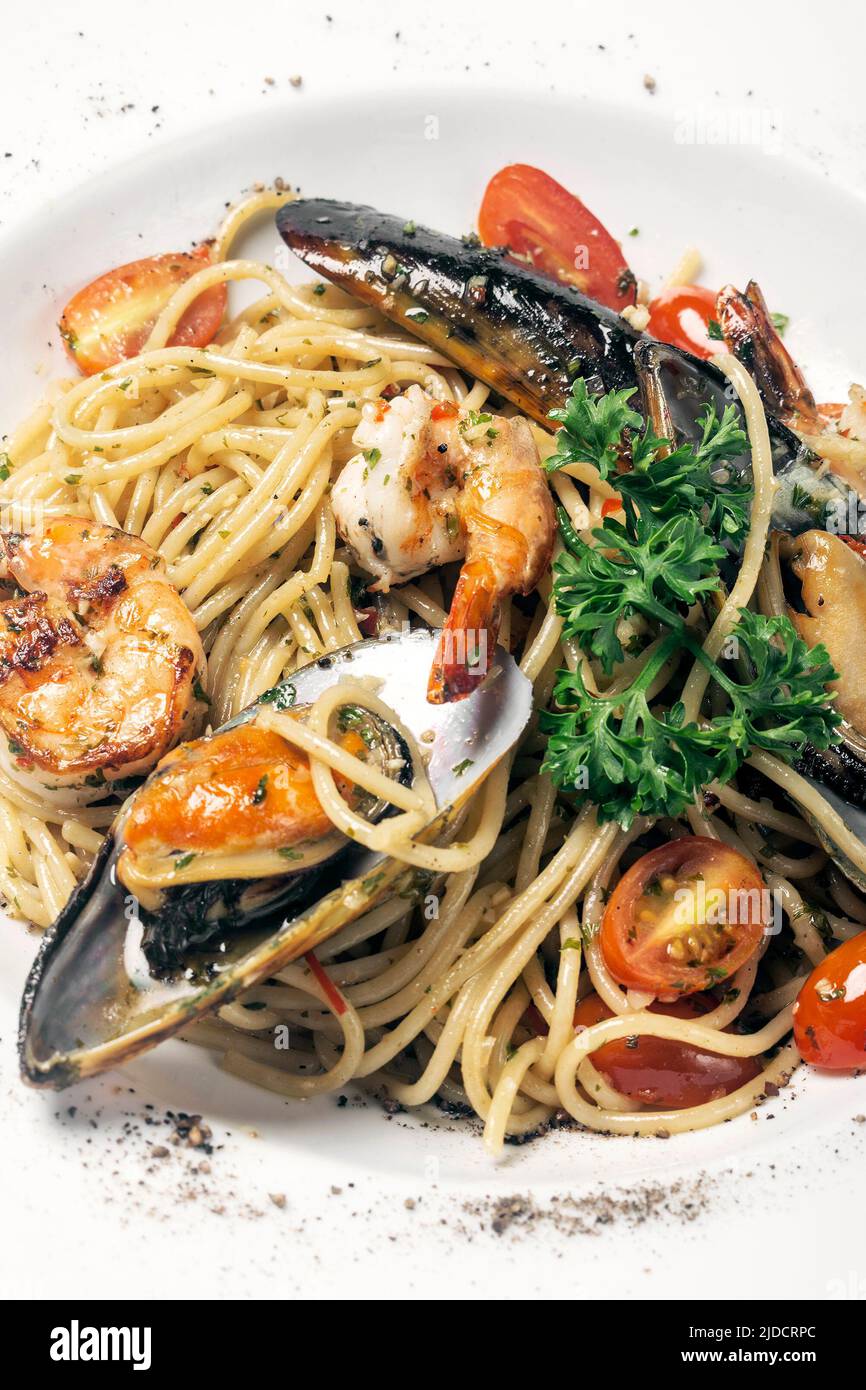 frutti di mare fresh mixed seafood spaghetti on white background Stock Photo
