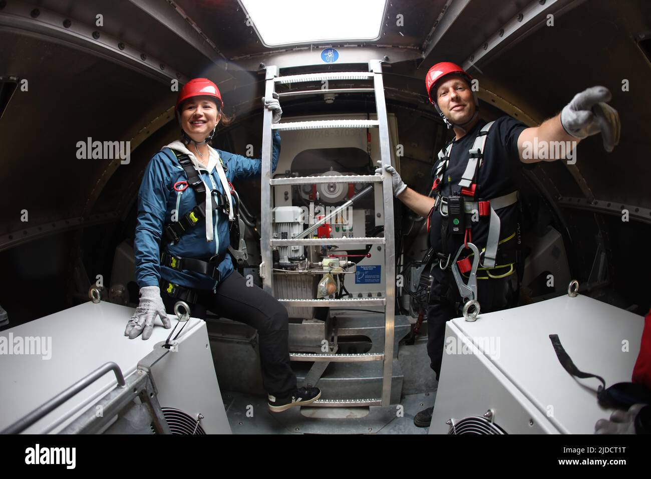 Nordhausen, Germany. 20th June, 2022. Anja Siegesmund (Greens), Minister for the Environment, Energy and Nature Conservation of Thuringia, and Enercon Area Manager Lars Krausmann stand with safety equipment during a visit to a wind turbine at the Netzelsrode wind farm. Credit: Matthias Bein/dpa/Alamy Live News Stock Photo