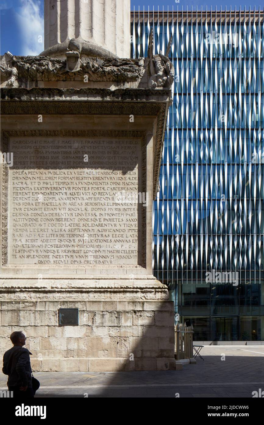 Detailed juxtaposition of Monument engraving and modern building facade. 1113 Monument Street