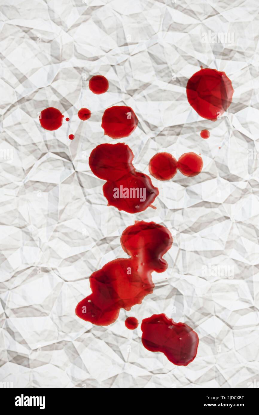 drops of blood on crumpled paper Stock Photo