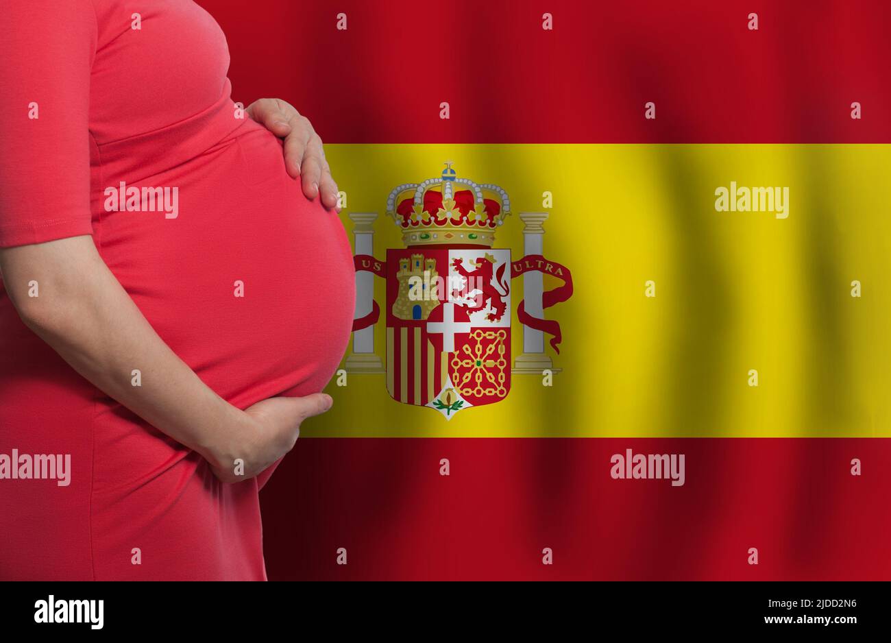 Spanish pregnant woman belly on Spanish flag background Stock Photo Alamy