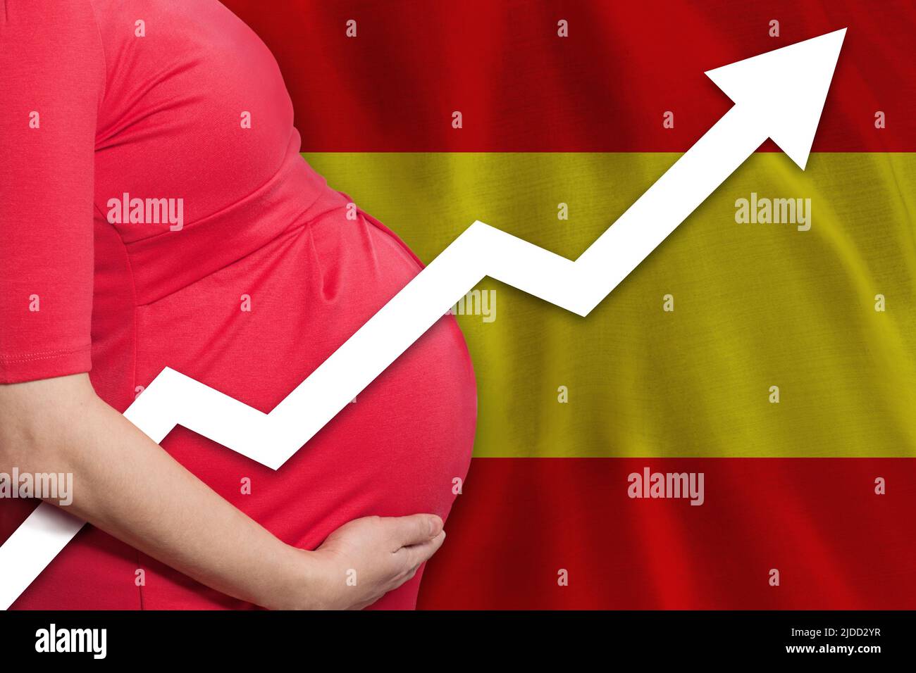 Spanish pregnant woman on flag of Spain background. Birth rate up Stock
