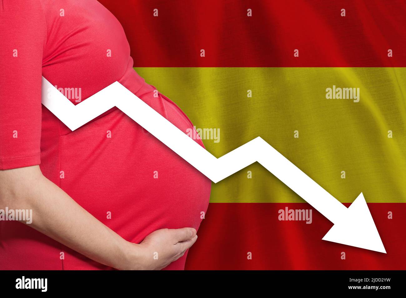Spanish pregnant woman on Spanish flag background. Falling fertility