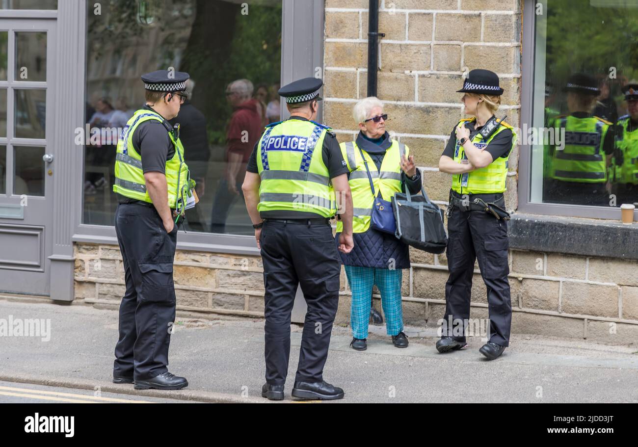 Small group of policemen and women in conversation at the the Uppermill Whit Friday Contest, England. Stock Photo