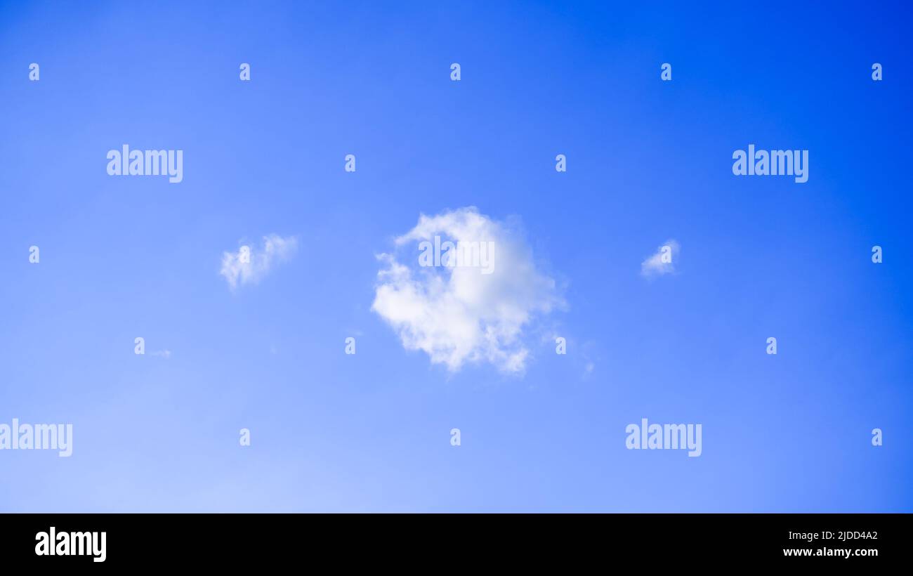 Blue sky with fluffy white clouds. Beautiful nature background Stock ...