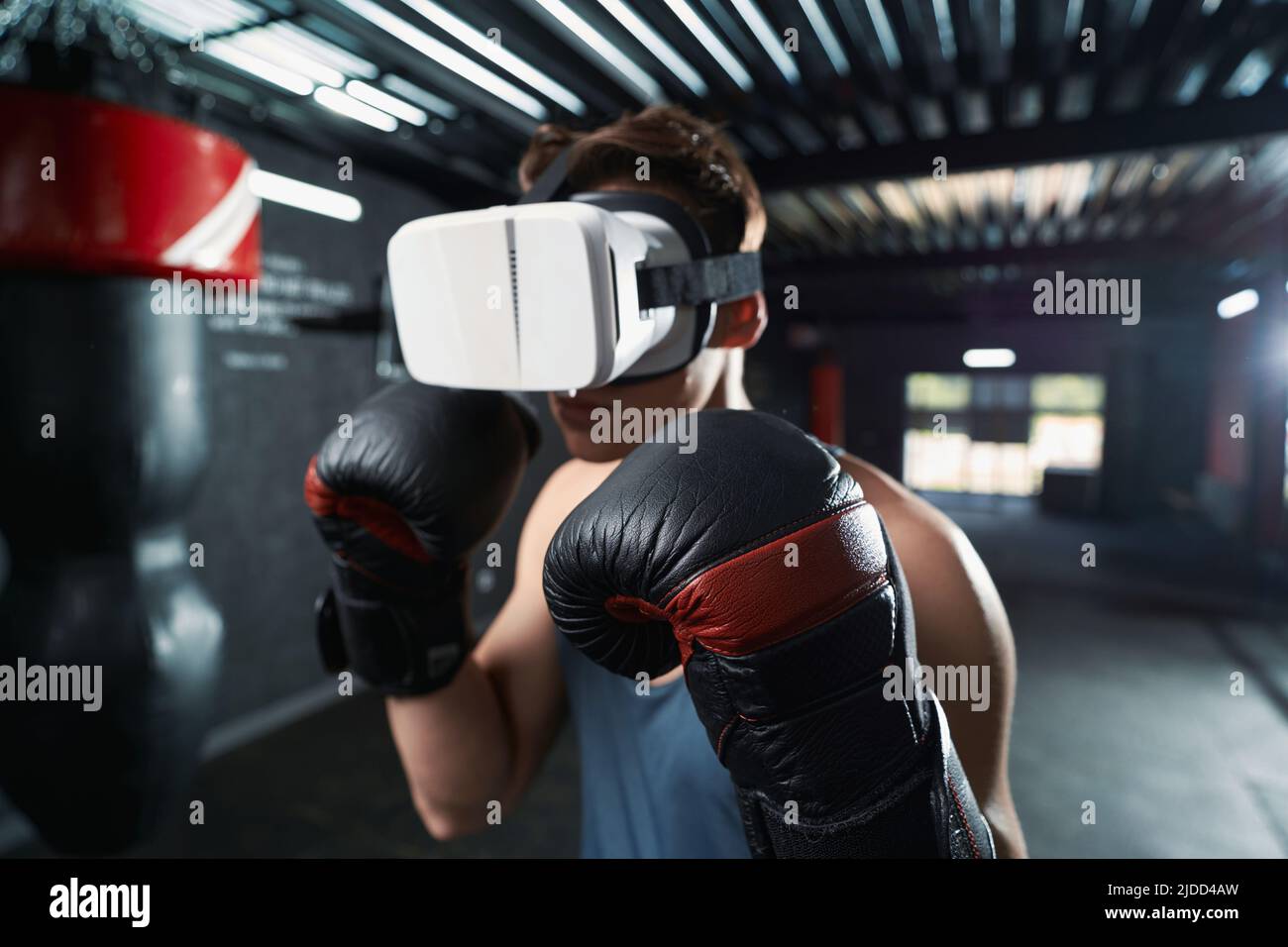 Professional sportsperson doing boxing workout in virtual reality Stock