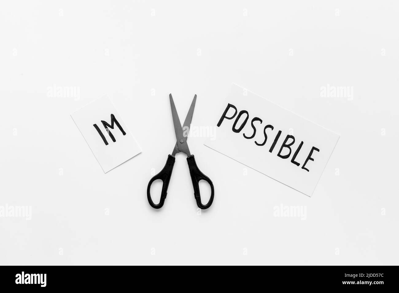 It is possible concept. Word Impossible becomes Possible with scissors ...