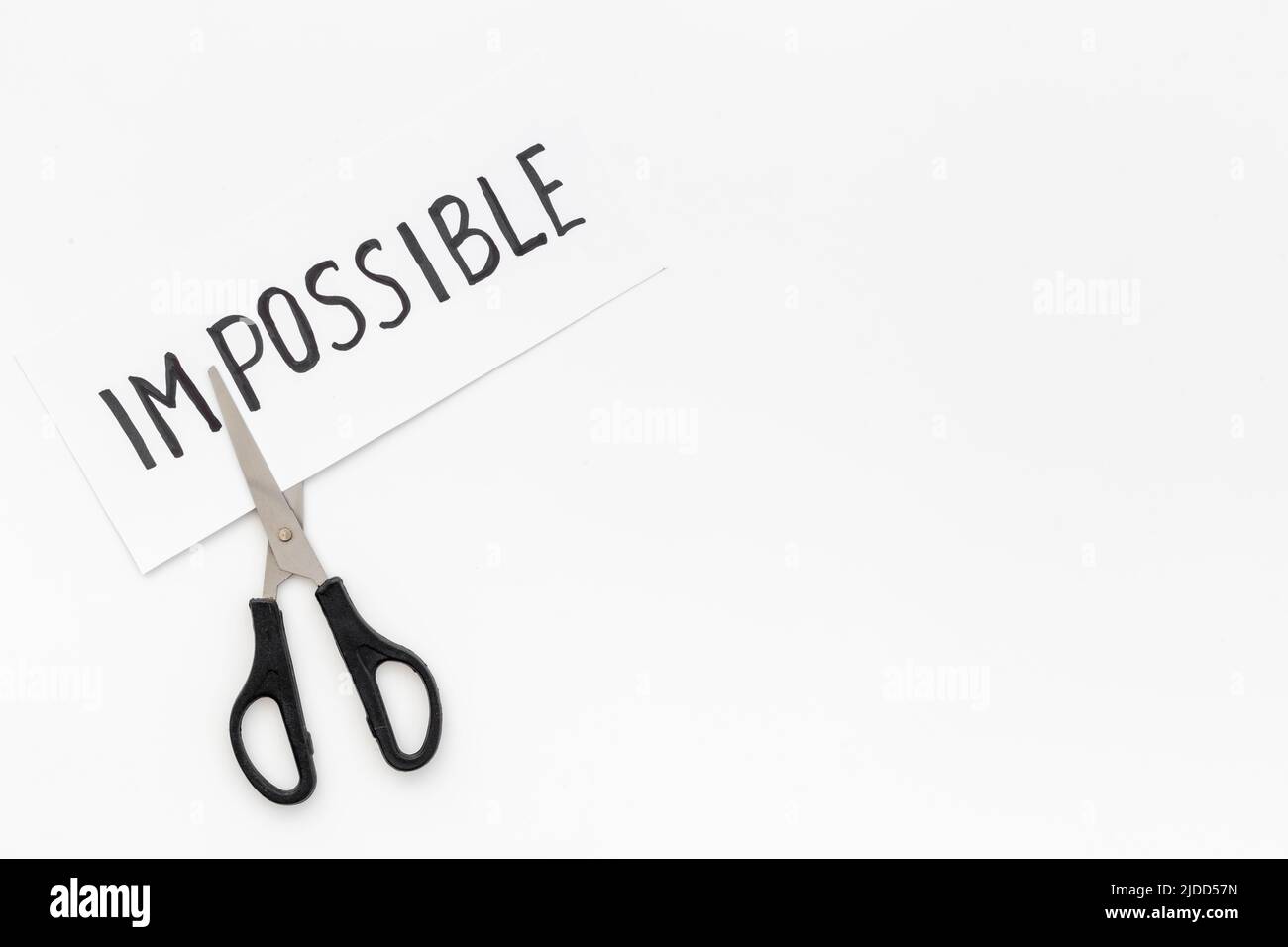 Paper card Impossible change into Possible with scissors Stock Photo ...