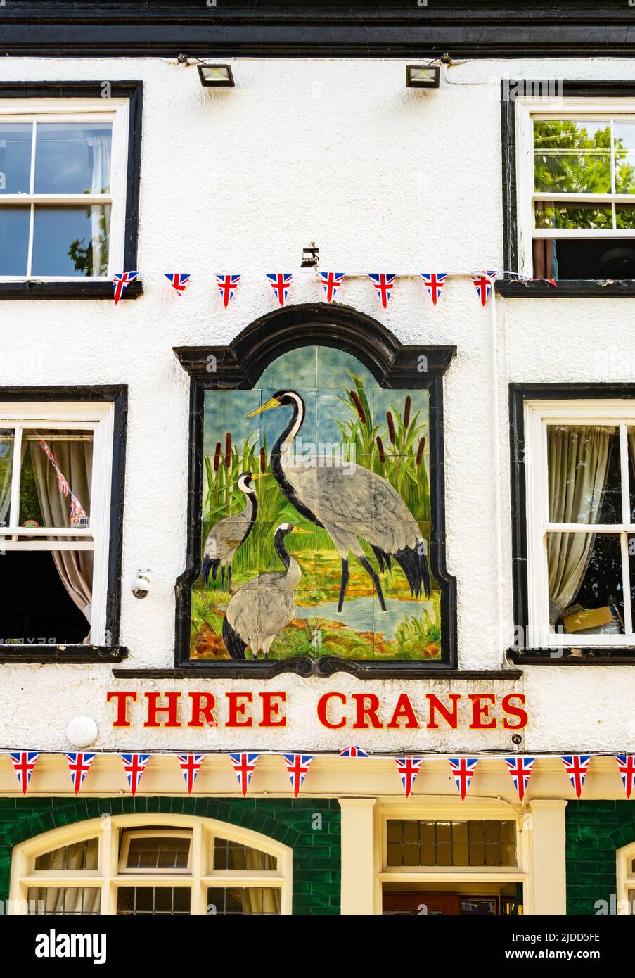 Sign and base-relief above the entrance to Three Cranes, an old pub  in the city of York Stock Photo