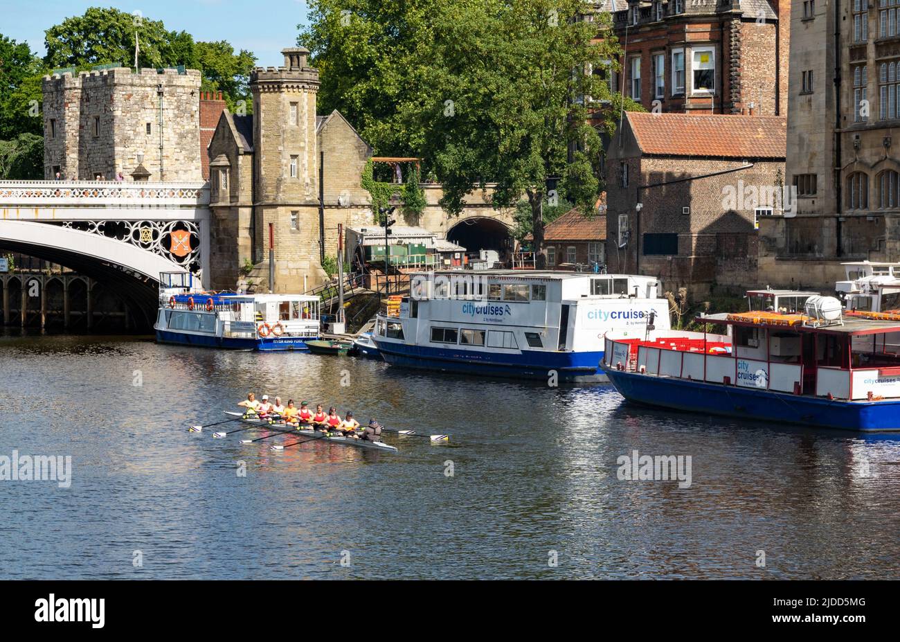 A female racing shell female team of 8 on the Ouse River in York Stock Photo