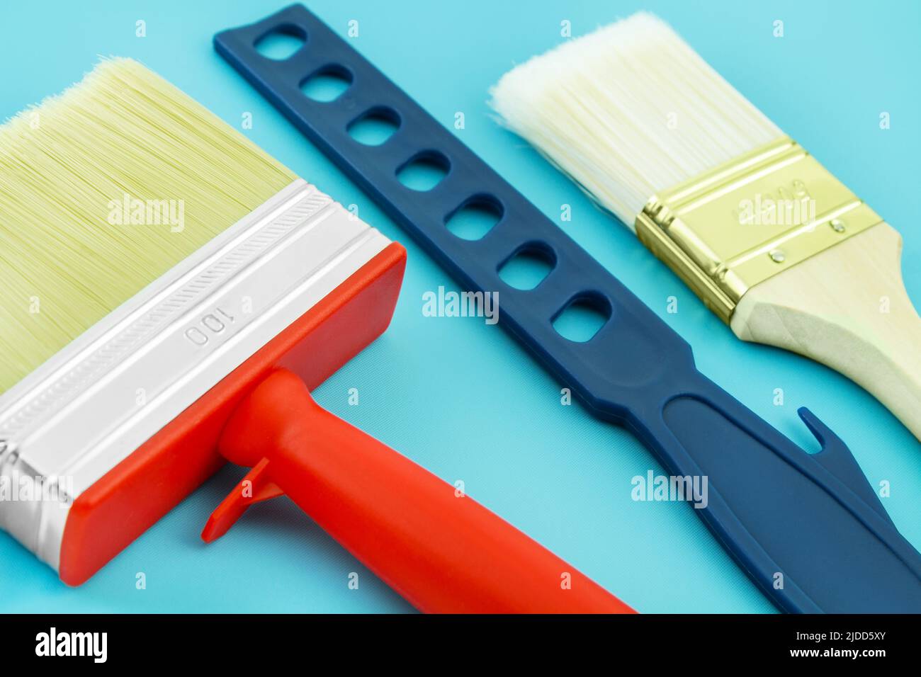 Various painting tools on blue background Stock Photo
