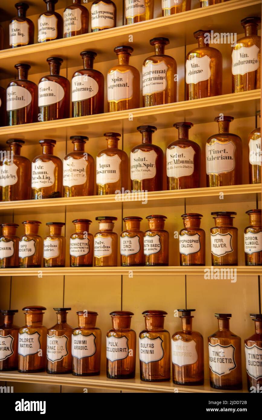 Enkhuizen, Netherlands, June 2022. Shelves with glass jars containing ingredients for medicine. High quality photo. Close up. Selective focus. Stock Photo