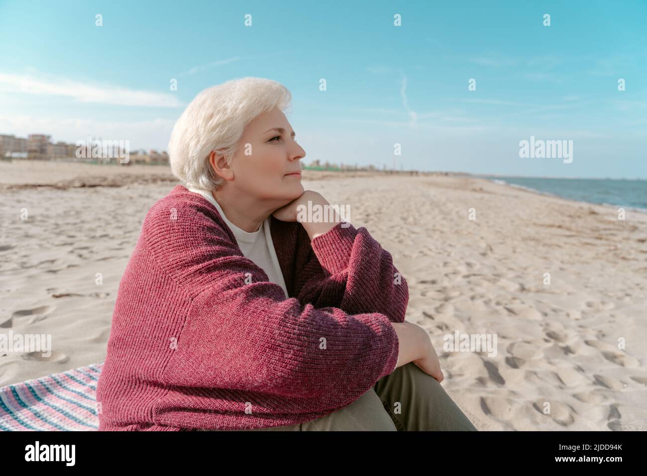 Thoughtful senior woman gazing hi-res stock photography and images - Alamy