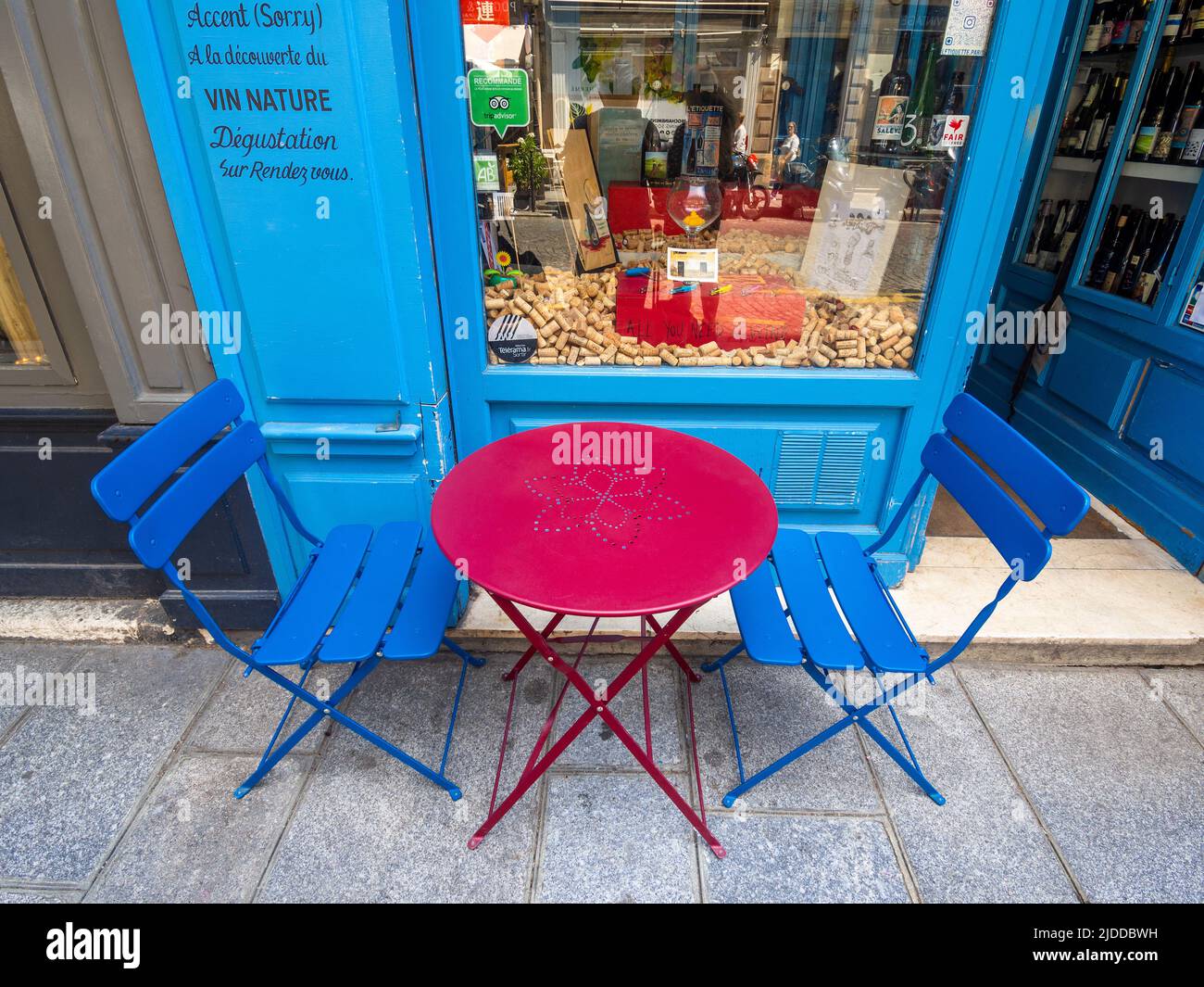 Colourful café table and chairs on the Rue Saint-Louis en l'Ile, Paris, France. Stock Photo