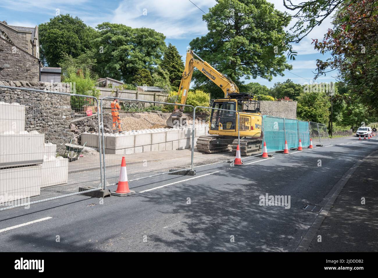 Completed blockwork now in  place at Kayley Hill, Long Preston where major work is taking place to repair a large wall ........20th June 2022. Stock Photo