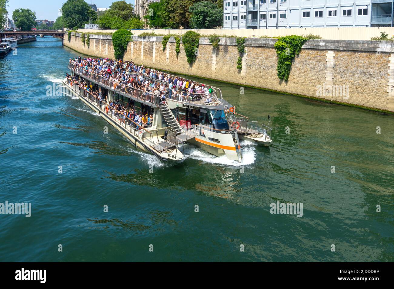 Sightseers on the bateau mouche 'Jeanne Moreau' on the river Seine, Paris, France. Stock Photo