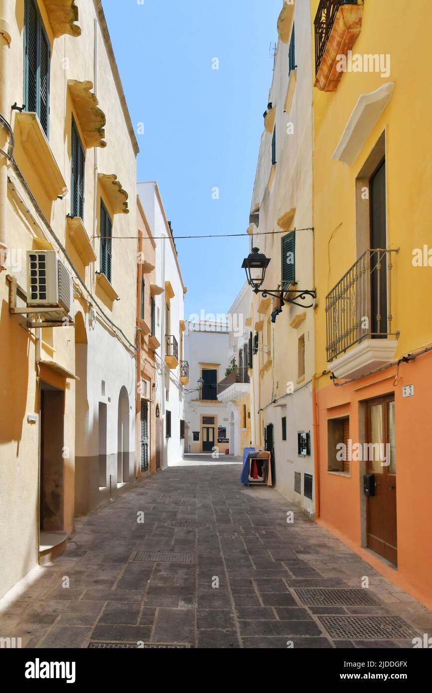 A narrow street between the old houses of Gallipoli, an old village in