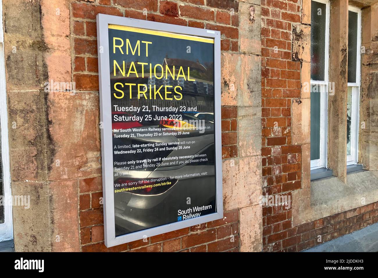 Axminster, Devon, UK.  20th June 2022.  RMT Rail Strike: RMT National Strike poster at the entrance to the railway station at Axminster in Devon on the London Waterloo to Exeter line served by South Western Railways which will have no trains on Tuesday 21st, Thursday 23rd and Saturday 25th June 2022 due to the rail strike by the RMT Union.  Picture Credit: Graham Hunt/Alamy Live News Stock Photo