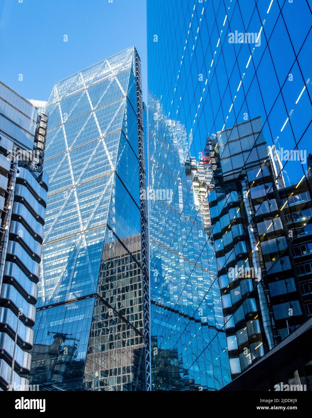 Towers in the City of London captured on Lime Street, the Leadenhall Building (Cheesegrate) and reflection of the Lloyds of London Building. Stock Photo