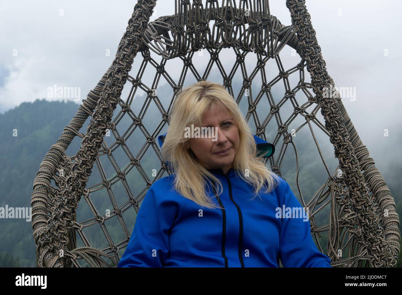 Rize, Turkey - July 2016: A young woman resting in a hammock in Pokut ...