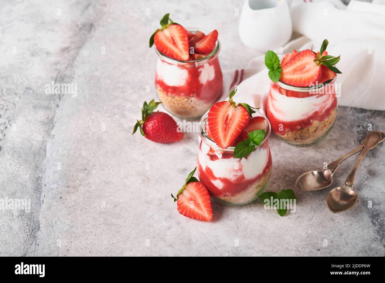 Strawberry Cheesecake. Cheesecake or trifle with strawberry in glass on