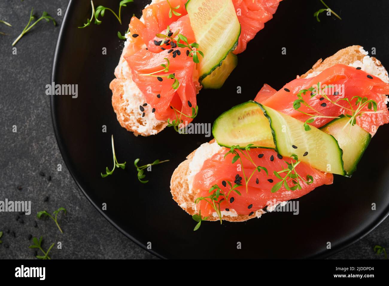 Sandwiches. Salmon toast with cream cheese, cucumber, black sesame and