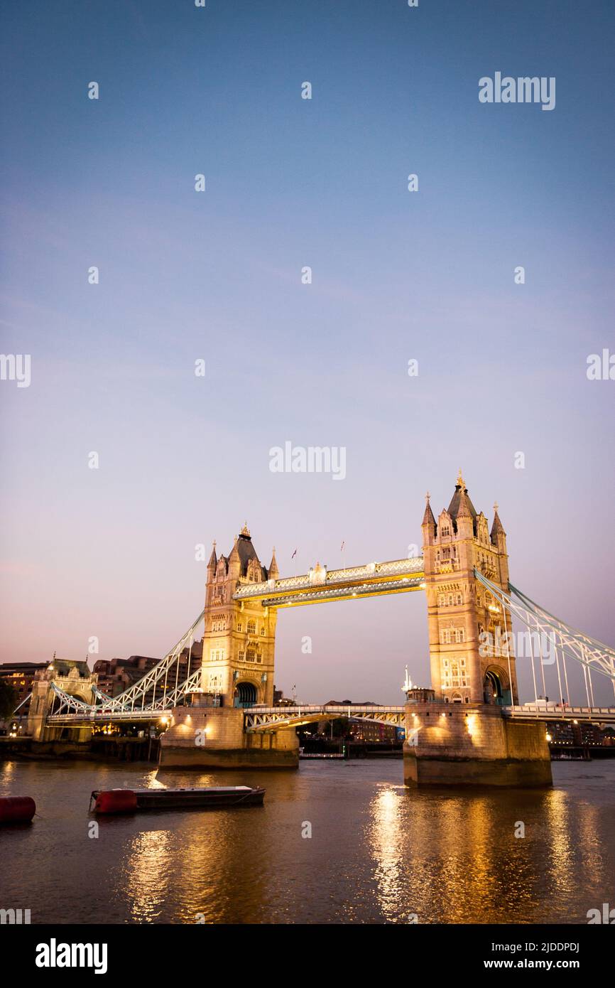 Tower Bridge and the River Thames, London. A dusk view over the Thames with the iconic Tower Bridge landmark dominating the scene. Stock Photo