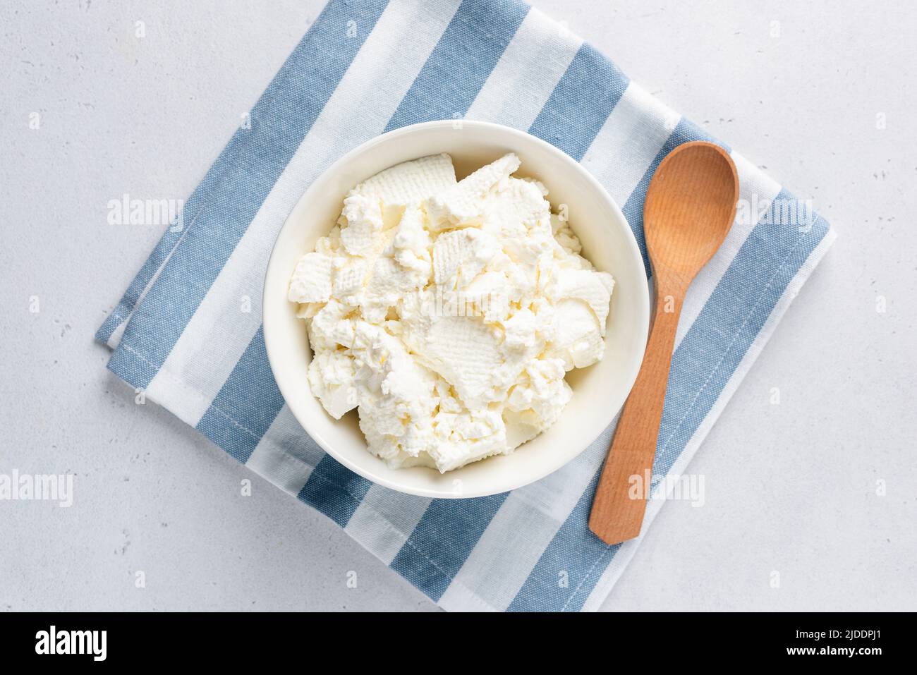 Homemade soft white Cottage cheese or Curd or Tvorog in a bowl, top view. Rich in protein and calcium dairy product Stock Photo