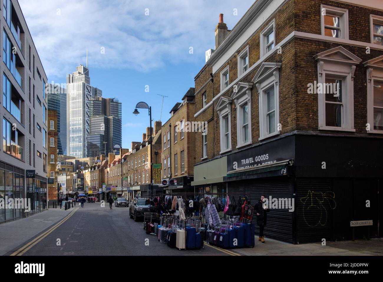Wentworth Street, Spitalfields, the modern home of Petticoat Lane Market, on a non-market day. City of London backdrop. Stock Photo