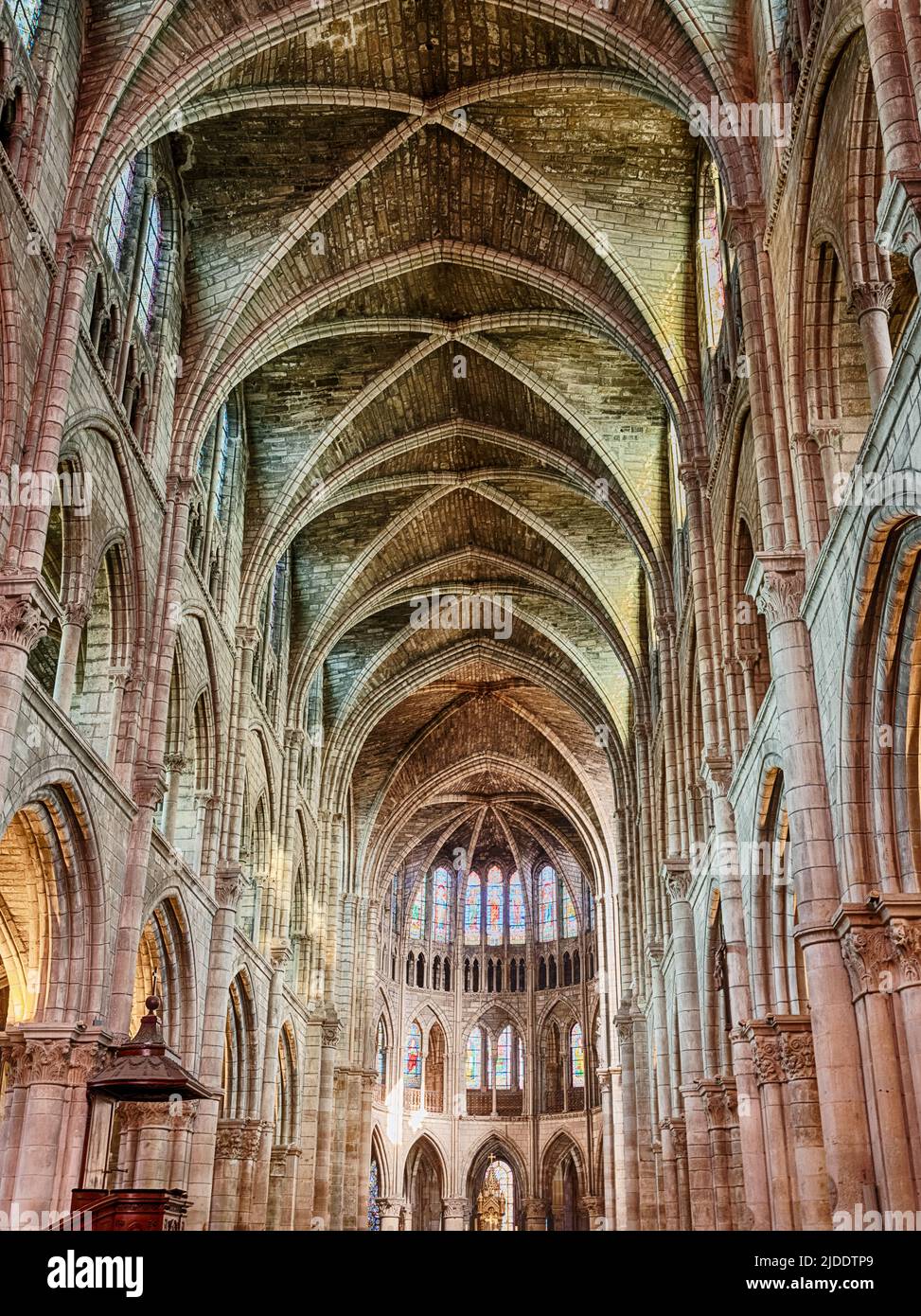 The interior of the cathedral at Chalons-en-Champagne glows with color from the late afternoon light in the fall. Stock Photo