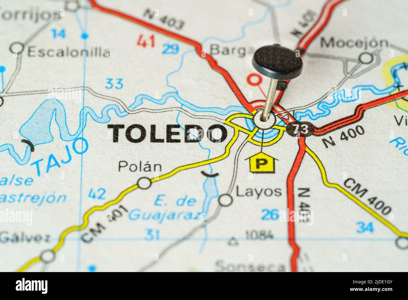 Tourist destination of Toledo with a pin on a map, macro photo Stock