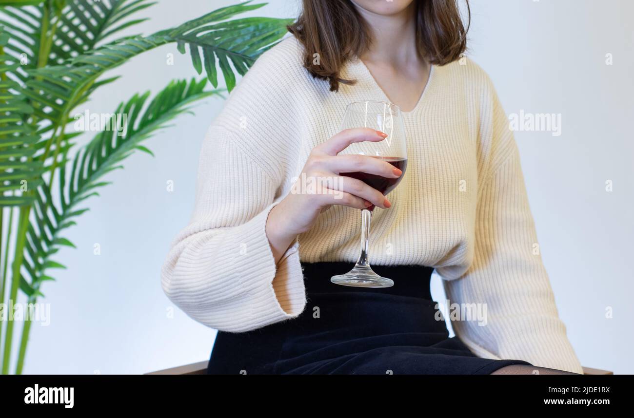 woman in white dress drinking wine from a wine glass Stock Photo - Alamy