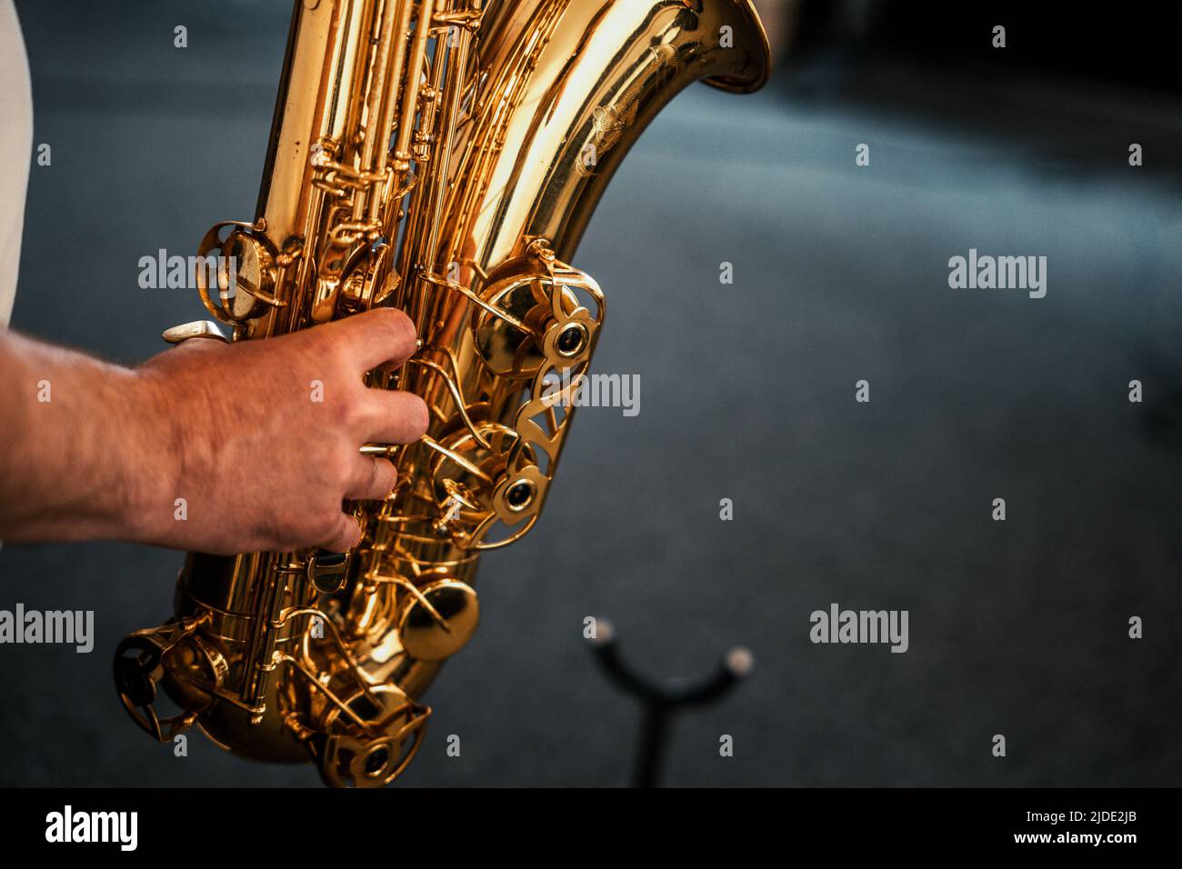 A Saxophone player playing a golden tenor sax Stock Photo Alamy