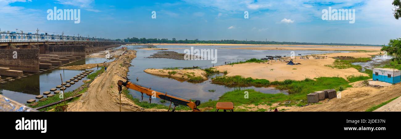 Panoramic View of Durgapur Barrage and Machineries with workers at the time of Log Sluice Gate Repair with Fishermen on the other side. Stock Photo