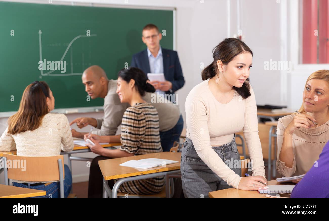 Multiracial group of students working in groups Stock Photo - Alamy